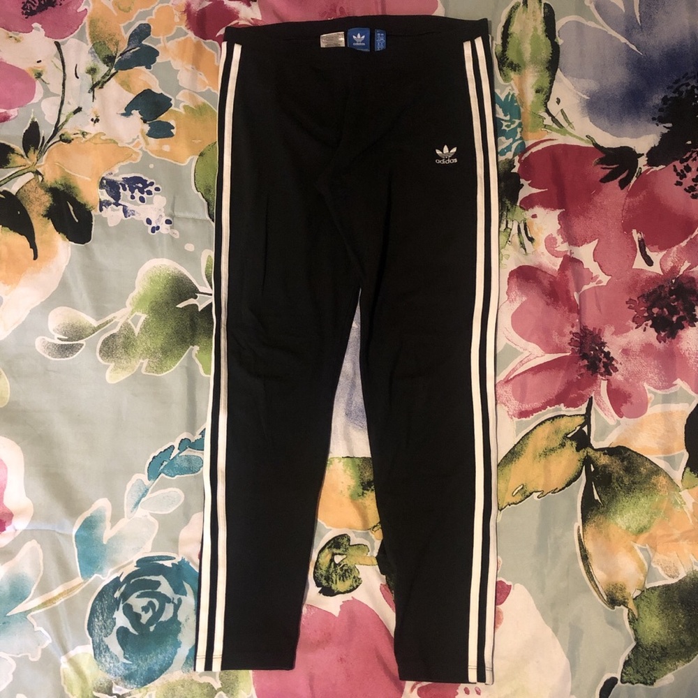 Black leggings with white stripes
